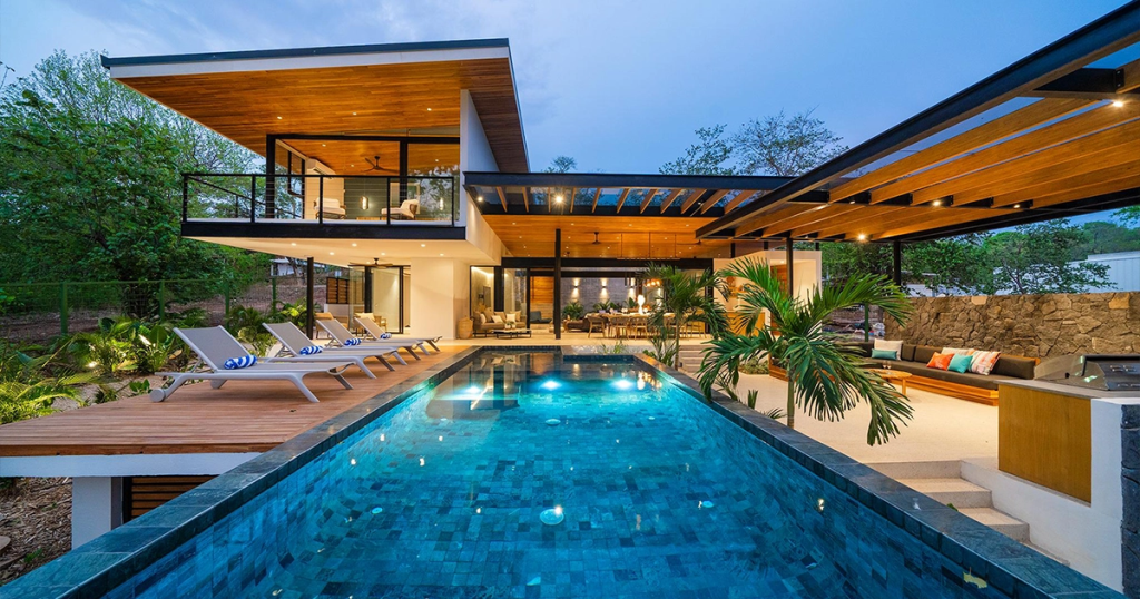 Casa Salvatico Grande pool and home at sunset in Playa Grande, Costa Rica